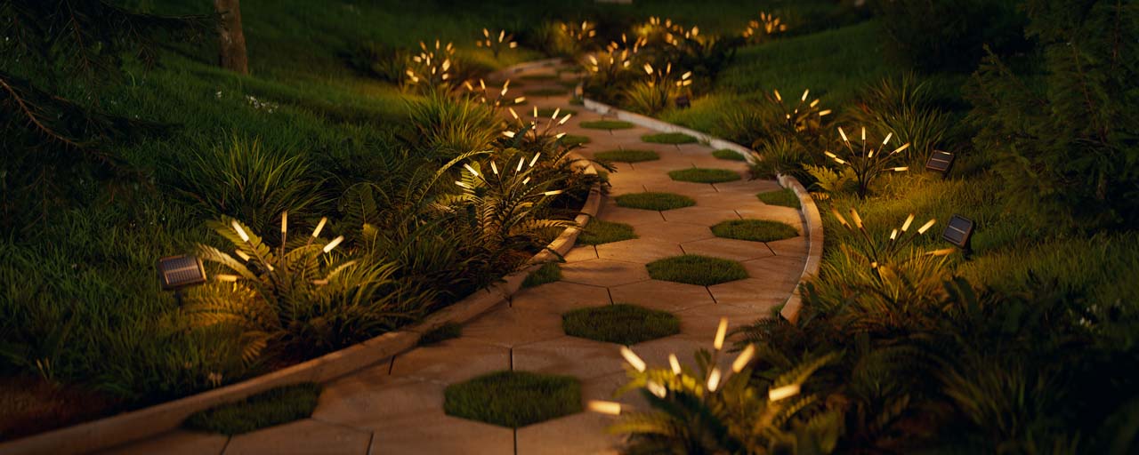 Éclairage extérieur Nanoleaf solaire le long d’une allée paysagère de jardin